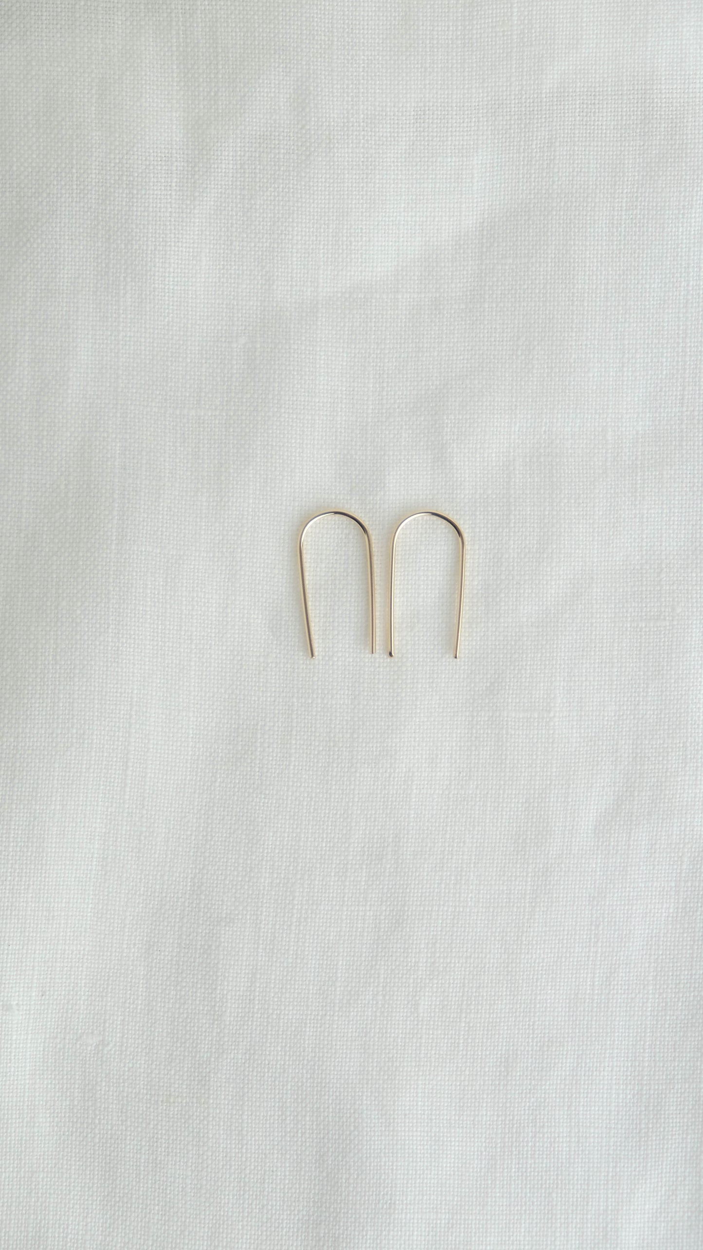 gold arc earrings