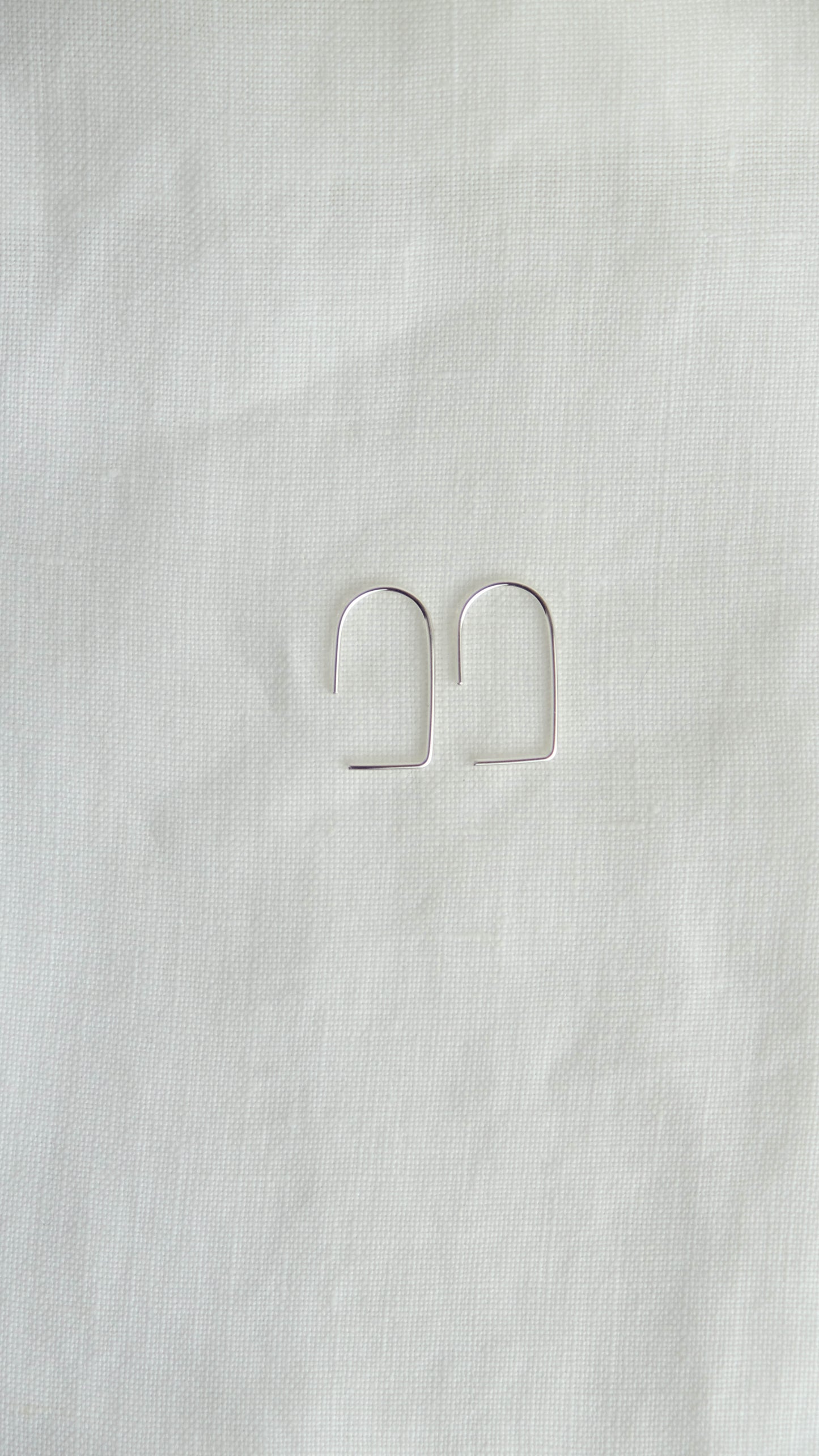 silver geometric arc earrings