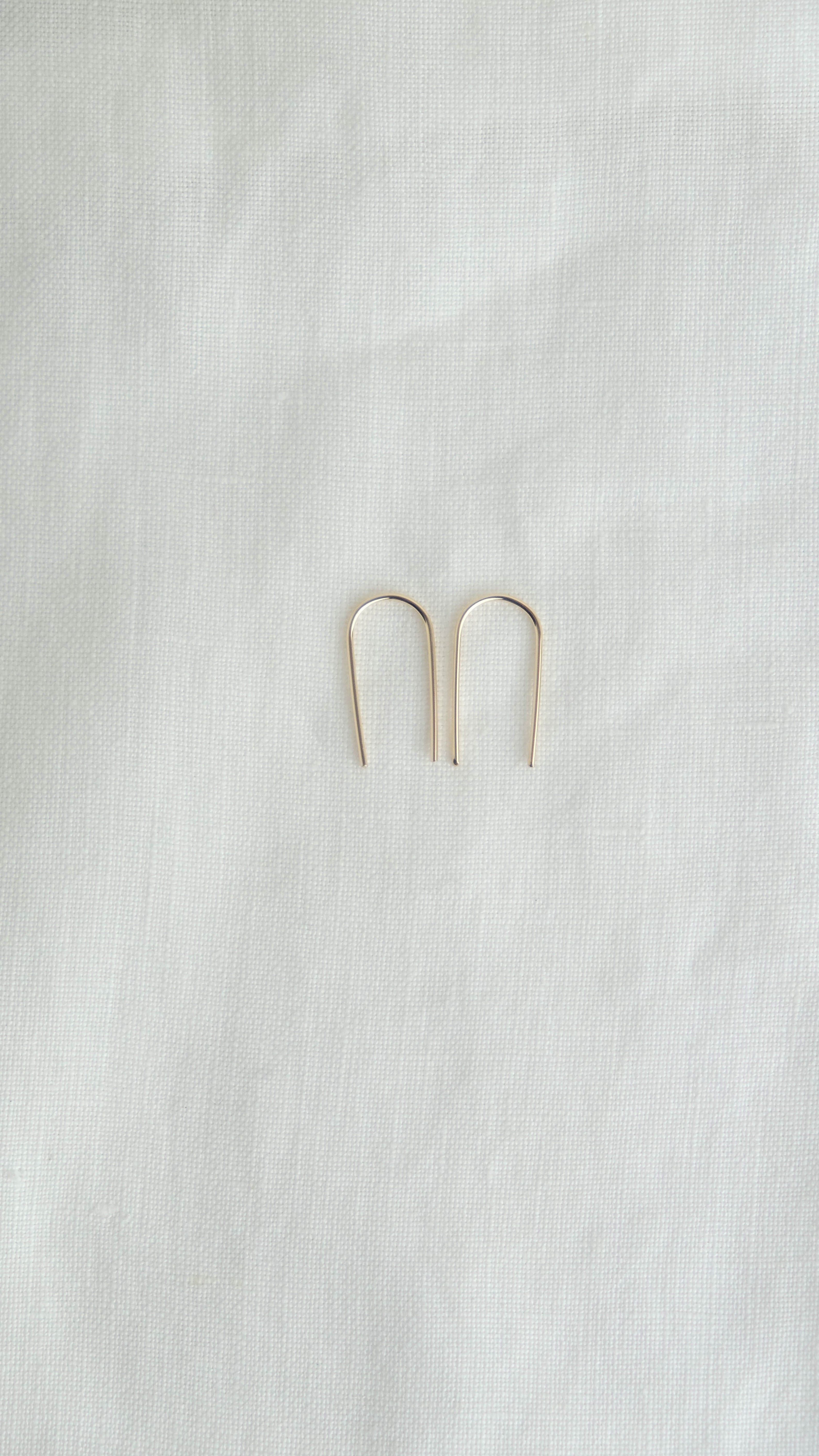 gold arc earrings