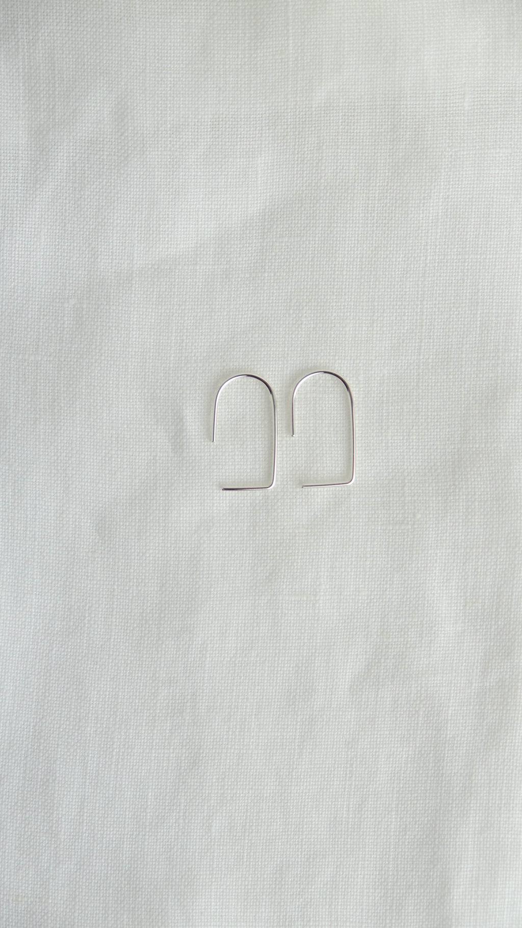 silver geometric arc earrings