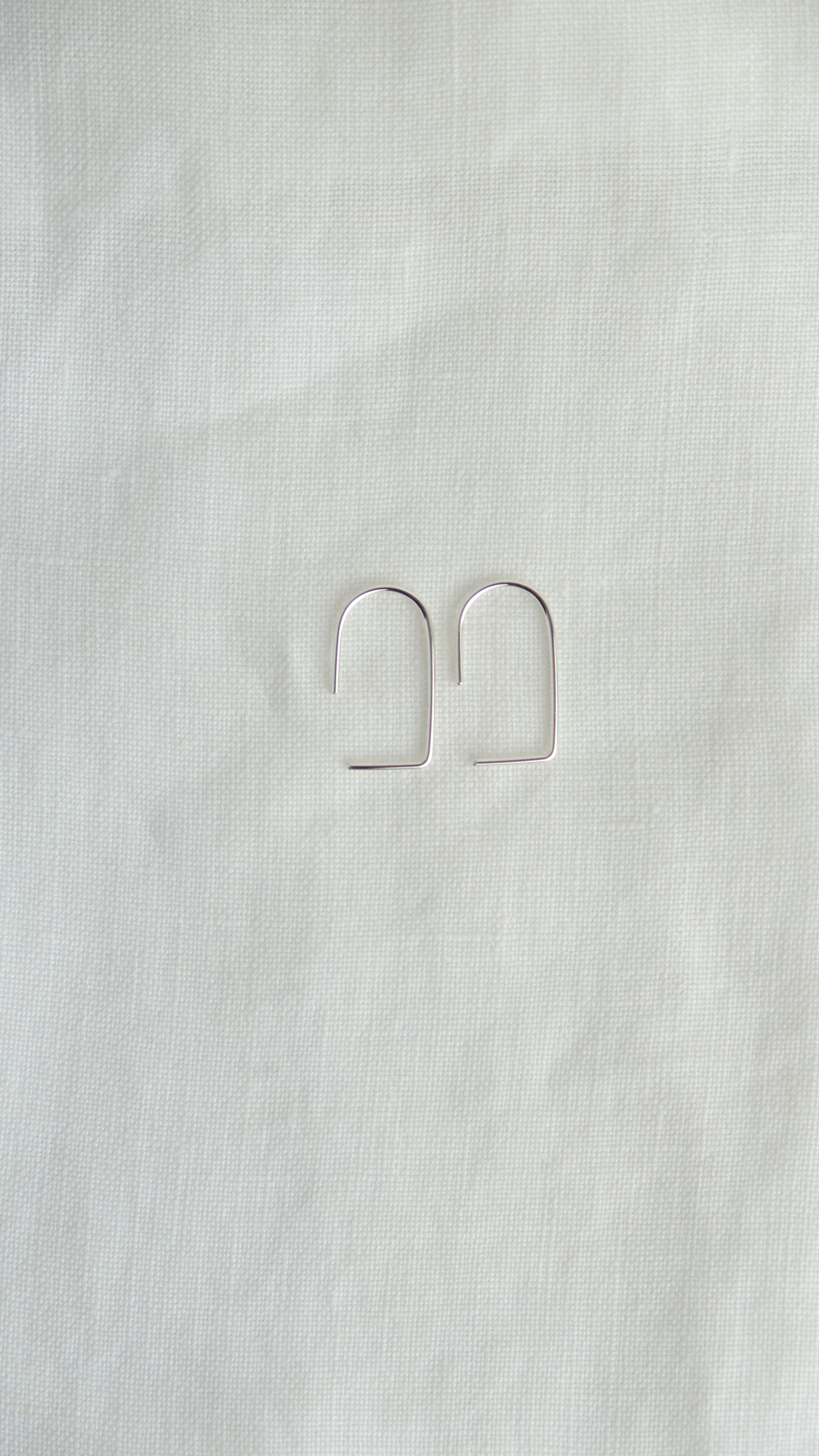 silver geometric arc earrings
